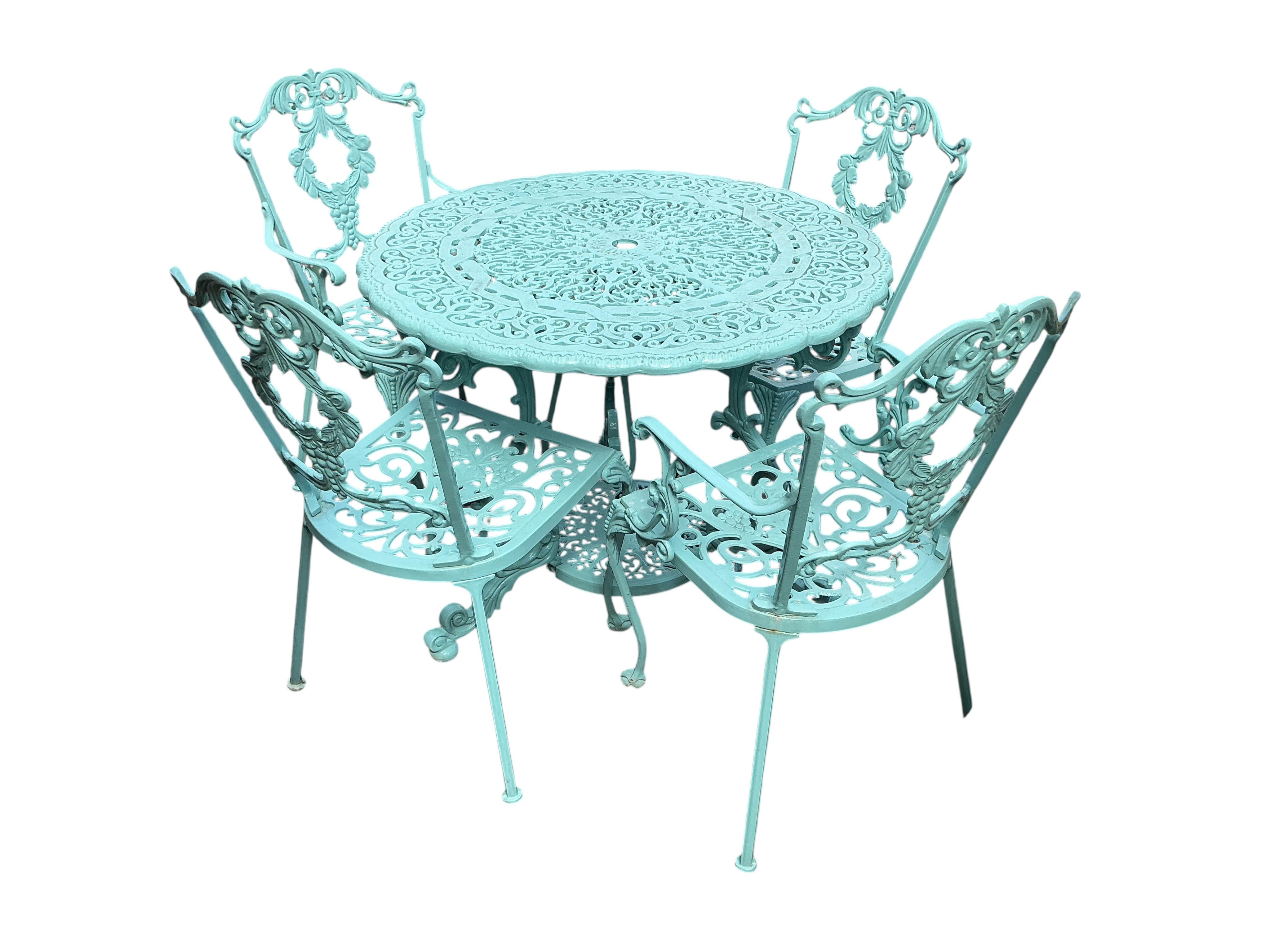 A painted circular aluminium garden table and four chairs, table diameter 92cm, height 71cm